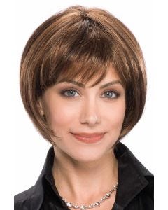 Woman in an ultra petite chin length medium brown rounded bob wig with fringe bangs
