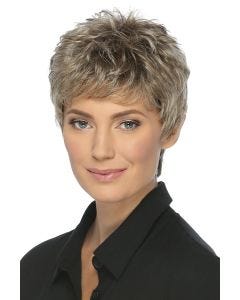 Woman in a tousled short blonde pixie wig with longer hair on the sides and back