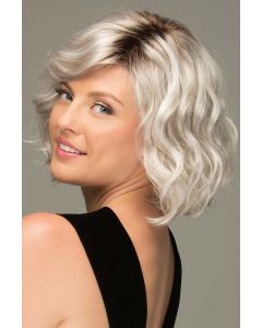 Woman in a chin length platinum blonde curly lace front bob wig
