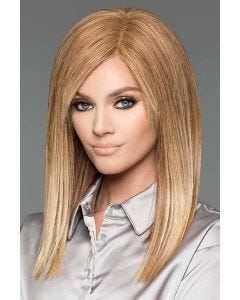 Woman in a past the shoulders straight light auburn human hair wig