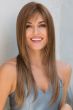 Woman in an extra long light brown wig with face framing layers and wispy bangs