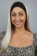 Woman wearing a long straight platinum blonde headband wig