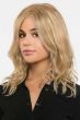 Woman in a past the shoulders warm blonde curly lace front wig