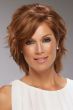 Woman in a medium auburn short and wavy shag wig with side swept bangs