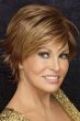 Raquel Welch in a medium auburn long pixie wig with choppy layers and side-swept bangs
