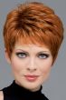 Woman in a copper red classic pixie wig with longer layers on top and fringe bangs