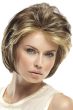 Woman in a light brown chin length lace front bob wig with extra volume along the forehead