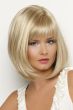 Woman in a shoulder length light blonde bob wig with face framing layers and feathered bangs