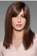 Woman in a past the shoulders dark brown human hair wig with side bangs