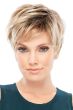 Woman in large cap pixie cut wig