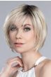 Woman in a chin length light blonde stacked lace front bob wig