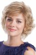 Woman in a past the chin light blonde curly wig with side bangs