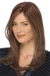 Woman in a long golden brown straight remy human hair wig