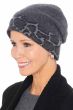 Woman in grey winter beanie hat with leopard print accents for cancer patients