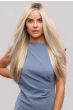 Woman in an extra long platinum blonde lace front wig with face framing layers