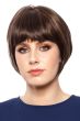 Woman in a chin length medium brown rounded bob wig with blunt bangs