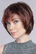 Woman in a chin length platinum blonde rounded bob wig