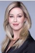 Woman in an extra long light blonde lace front straight wig