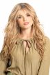 Woman in an extra long red blonde wig with beach waves and curtain bangs