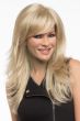 Woman in an extra long light blonde wig with feathered layers and side bangs