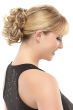 Woman in a 5" light brown curly clip on ponytail