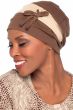 Woman in a slouchy snood style burgundy chemo turban with laces and bow on the side