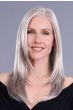 Woman in a long dark auburn lace front wig with middle part and face framing layers
