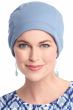 Woman in blue cotton chemo cap with cuff for women with cancer