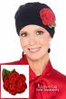 Woman in a black Couture Cap with a crocheted camellia flower brooch attached