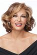 Woman in a shoulder length volume-infused curly dark brown bob wig