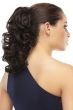 Woman in a dark brown layered 12" curly clip on ponytail