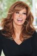 Raquel Welch in a past the shoulders medium red blow out wig with layers and long side bangs