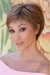 Woman in a textured dark brown pixie wig with wispy bangs