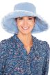 Woman in spring and summer extra wide brimmed denim floppy hat with wired brim and distressed edges for cancer patients