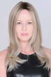 Woman in an extra long ash blonde lace front wig with long layers