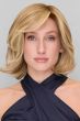 Woman in a short, blonde wavy lace front bob wig with side swept bangs