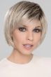 Woman in a chin length platinum blonde rounded bob wig