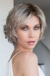 Woman in a chin length ash blonde bob wig with side bangs