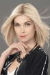 Woman in a 12" light blonde hair topper blended with her hair