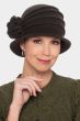 Woman in wool felt cloche winter hat with brim, pleating and flower on the side