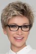 Woman in glasses in a tousled blonde lace front pixie wig with dark roots