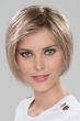 Woman in a chin length light blonde stacked lace front bob wig