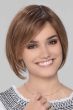 Woman in a past the chin medium auburn lace front rounded bob wig