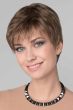 Woman in a medium brown close cropped lace front pixie wig