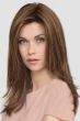 Woman in a past the shoulders straight medium brown lace front wig with long layers