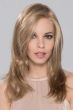 Woman in a light blonde past the shoulders lace front wig with long layers