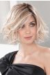 Woman in a chin length light blonde curly lace front wig