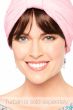 Woman in auburn brown detachable synthetic bangs worn under a turban
