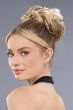 Woman in a 4" dark brown curly scrunchie bun hair piece