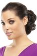 Woman in a 4" dark brown curly scrunchie bun hair piece